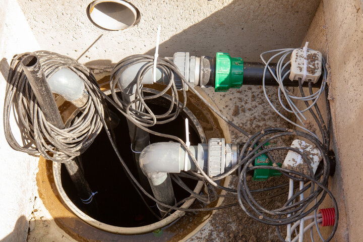 A sump pump with wires.