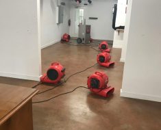 fans set up to dry water damage project