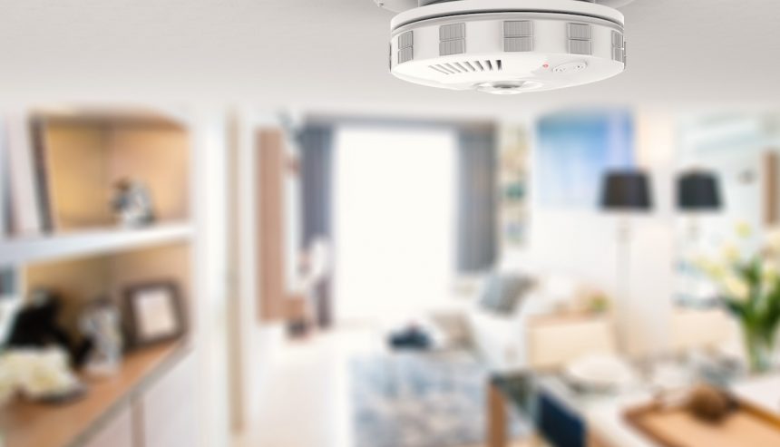 Smoke detector on ceiling. Choosing the best of the smoke detector types can protect your home and family.