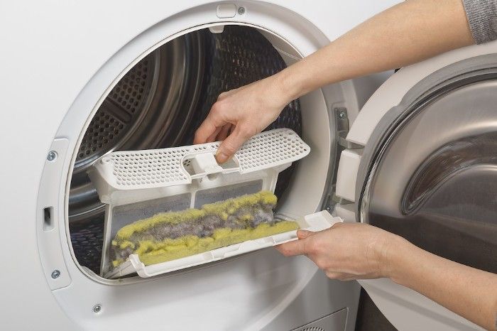 Cleaning your lint trap is a dryer fire prevention tip.