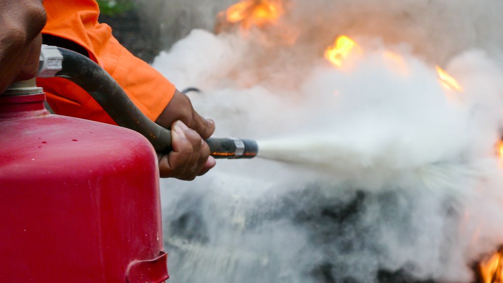 Putting out a fire with a fire hydrant