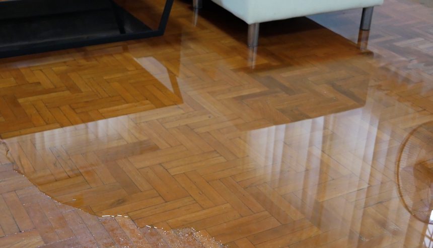 Winter flood water on wood floor. Prevent Water damage in winter