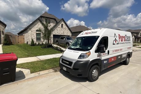 Van in front of a home. Why you should use a restoration company for mold remediation.