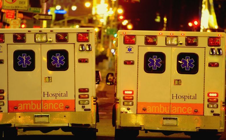 two ambulances driving side by side