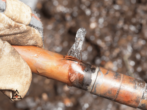 frozen pipe with ice poking from burt section