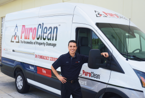 PuroClean technician beside van stating Paramedics of Property Damage