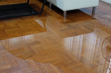 water flowing over hardwood floor