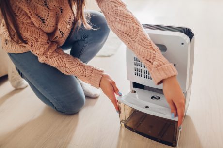 Using a dehumidifier to dry out water-damaged areas