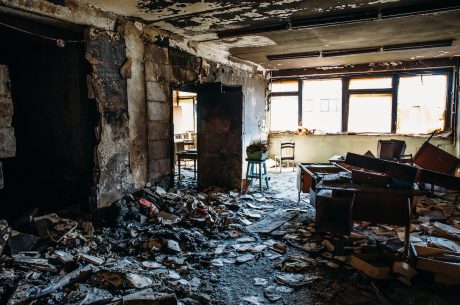 Aftermath of a living room destroyed by a fire.