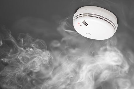 Smoke detector surrounded by smoke.