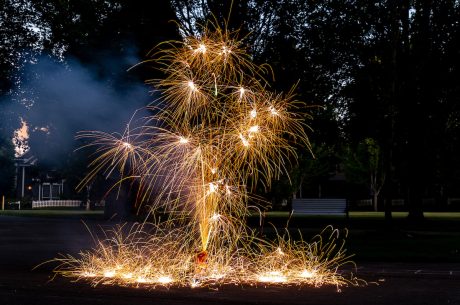 Sparklers going off on the street.