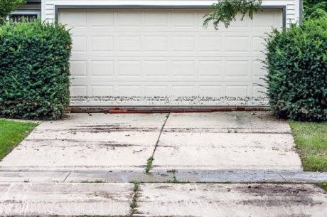 Image of garage with evidence of flooding on the door