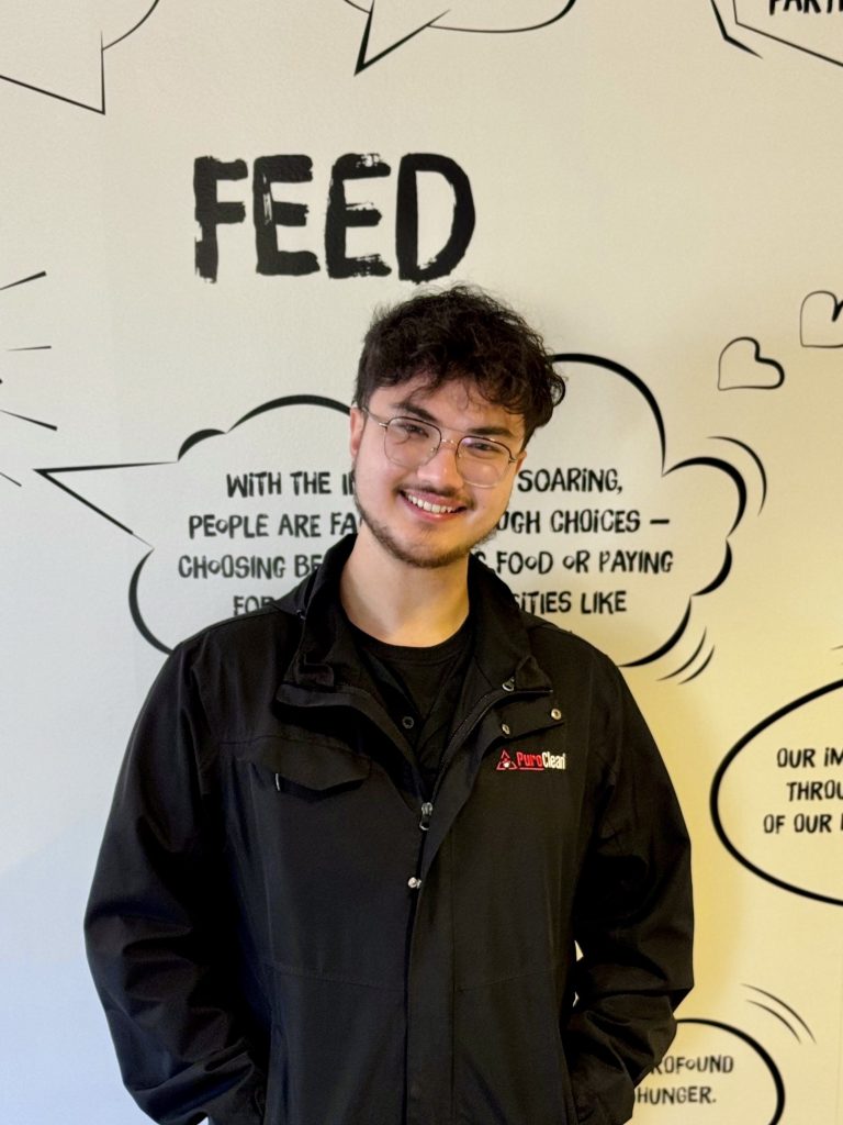 Tyler at the Feeding San Diego office after dropping off donated goods.