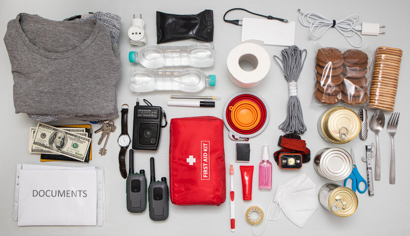 An emergency kit that includes non-perishables and bottled water.