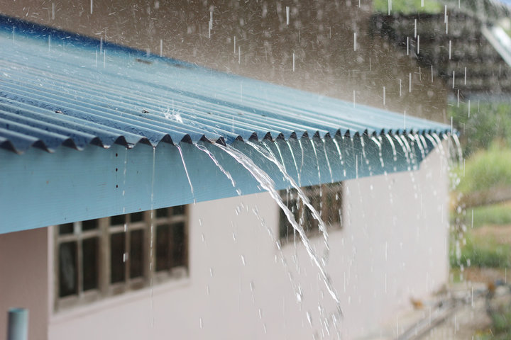 Heavy rain on roof from summer storms.