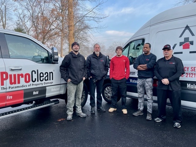 PuroClean of Wayne team in front of company trucks. Learn about PuroClean and what we can do for you!