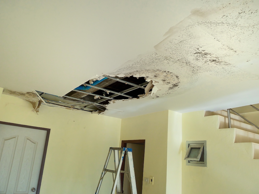 A leaky roof damages a ceiling