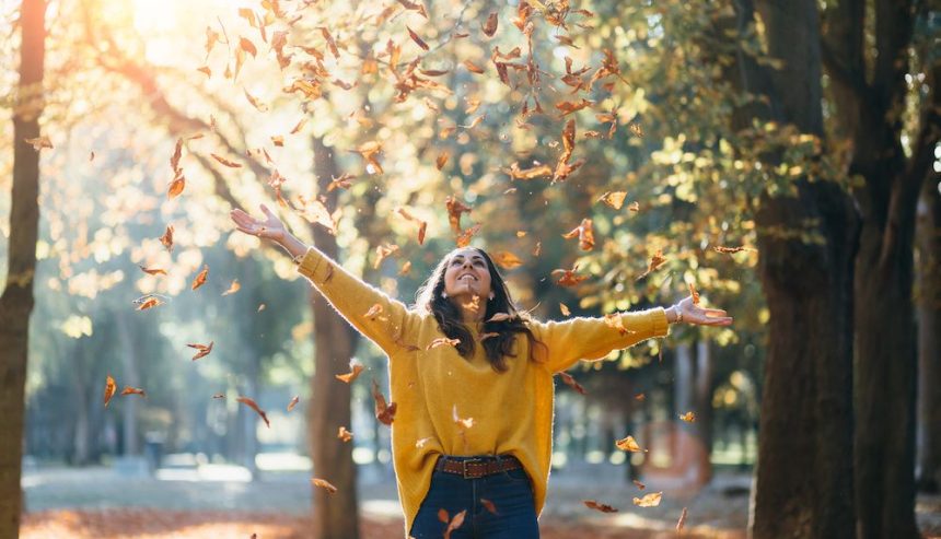 A woman enjoys the fall foliage