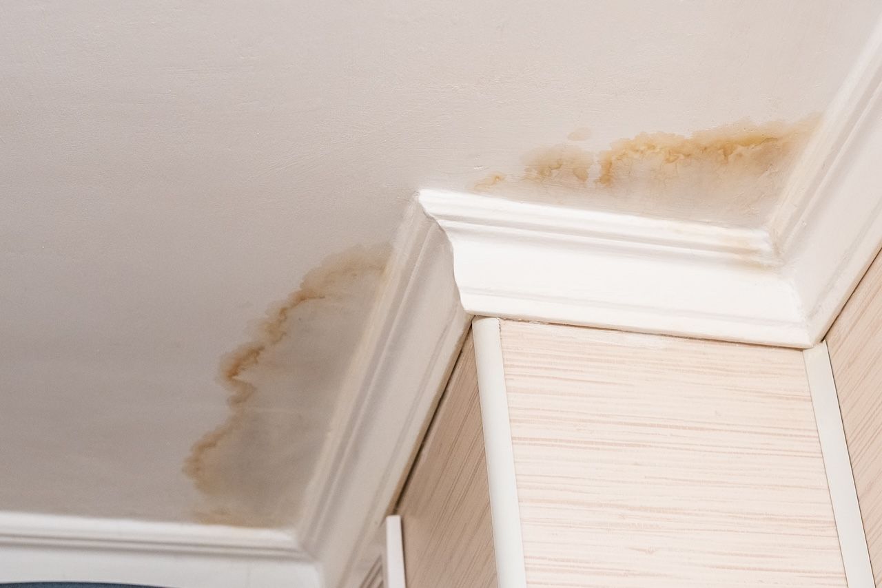 water stains on a ceiling, which can indicate a bathtub leak