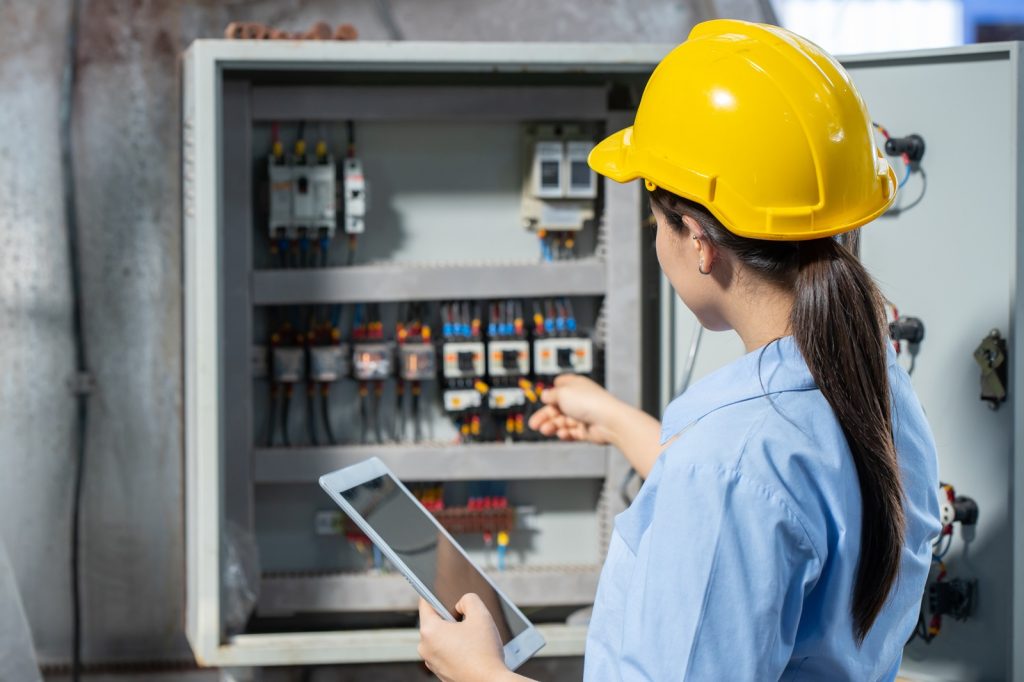 Electrician Engineer working check service maintenance electricity main circuit fuse and power system in industry factory