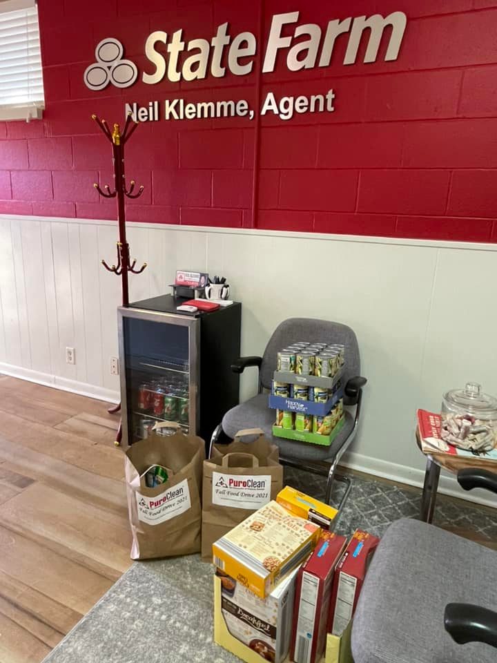 Collection of food at local State Farm office for PuroClean food drive.