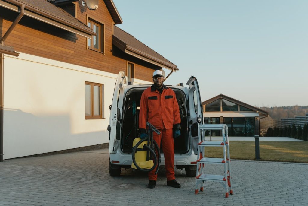 Man with a vacuum cleaning